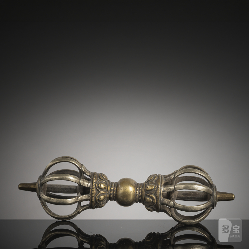 Nine-rayed bronze vajra